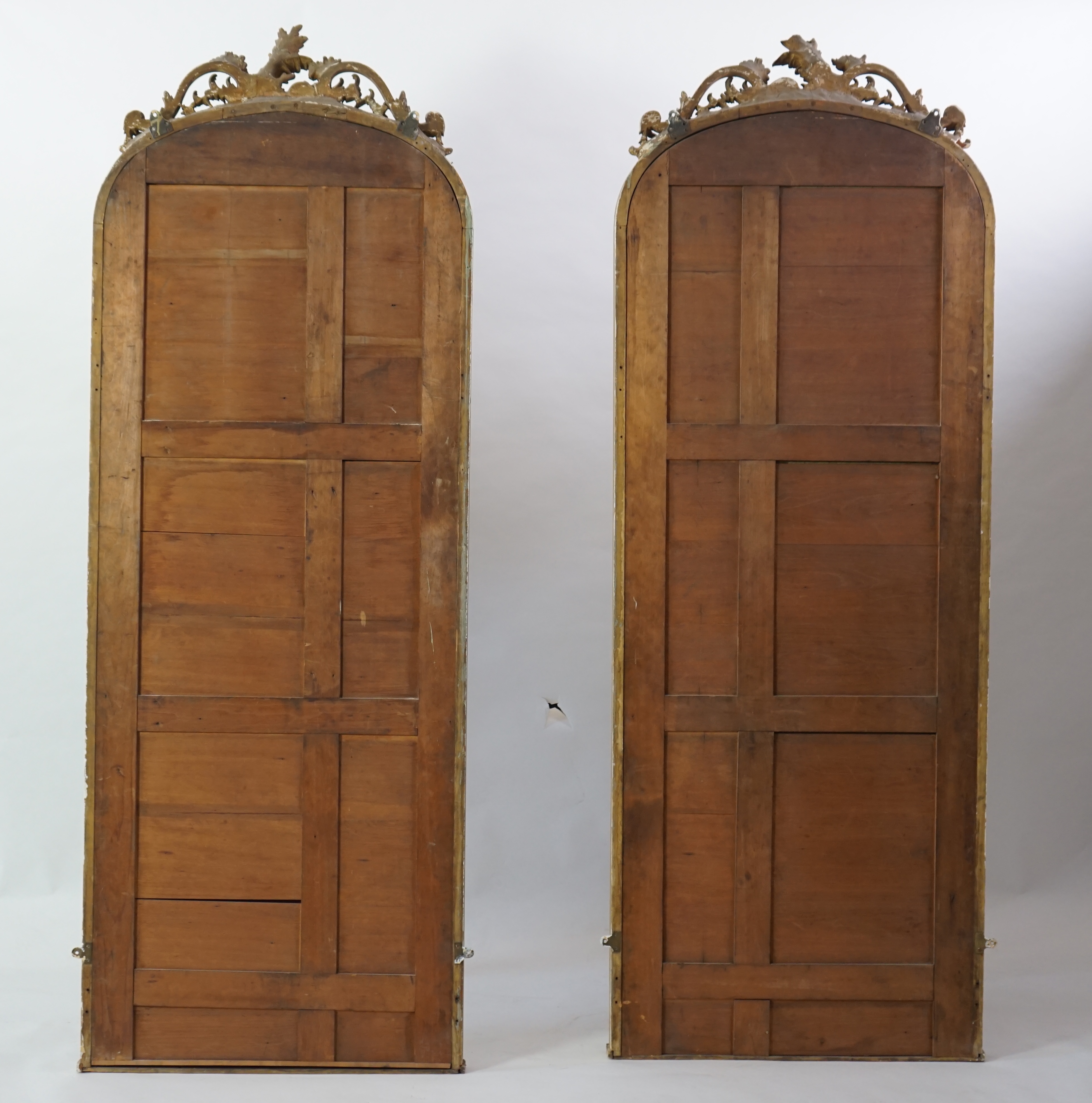 A pair of late 19th century giltwood and gesso pier glasses